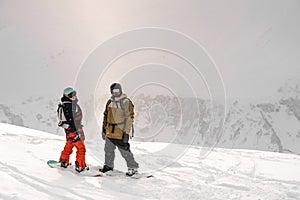 Two sportsmen standing on top of mountain