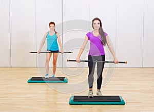 Two sporty girls at fitness club