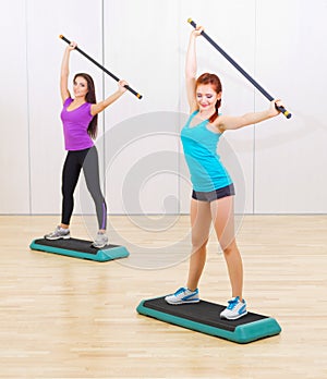 Two sporty girls at fitness club