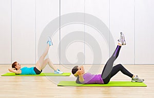 Two sporty women at fitness club