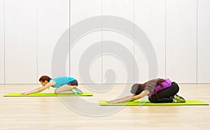 Two sporty women at fitness club