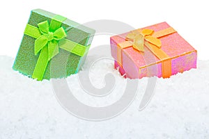Two square gift boxes in snow