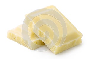 Two squares of white chocolate isolated on white. Rough edges