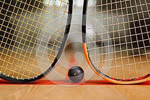 Two squash rackets and ball, game concept