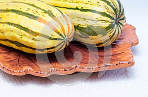 Two squashes on a plate
