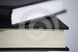 Two stacked books on white background