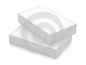 Two stacked white rectangular blocks on a plain background