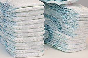 Two stacks of baby diapers