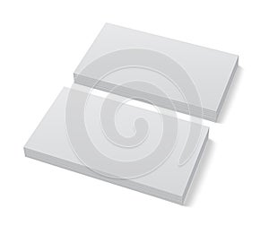Two stacks of blank business cards on white