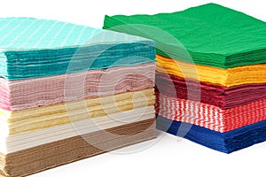 Two stacks of colorful paper napkins on white background