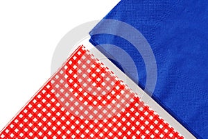 Two stacks of colorful paper napkins on white background