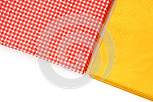 Two stacks of colorful paper napkins on white background