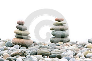Two stacks of stones over white