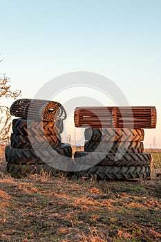 Two stacks of tractor tyres