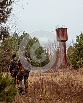 Two stalkers on abandoned farm in the Chernobyl Exclusion Zone photo