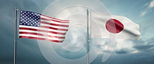 Two state flags of the united states of america and japan, facing each other and moving in the wind in front of cl