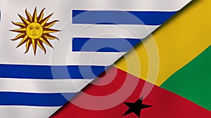 The flags of Uruguay and Guinea Bissau. News, reportage, business background. 3d illustration photo