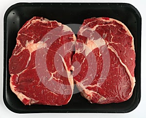 Two steaks on tray