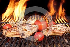 Two Steaks and Vegetables Char-Grilled Over Flaming BBQ Grill