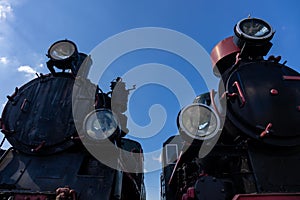 Two steam locomotives seen from the front.