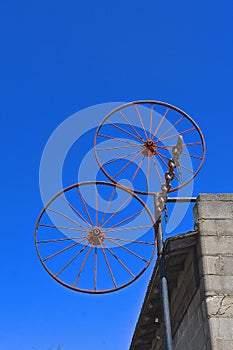 Two steel wheels welding together in the air.