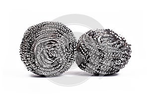Two steelwool pot cleaner scrubs on white background