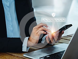 Two steps authentication 2FA concept. 2023, Shield and asterisk icons code showing on smart phone while using computer.