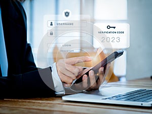 Two steps authentication 2FA concept. 2023, Verification code and key icon alert on smart phone while using computer.