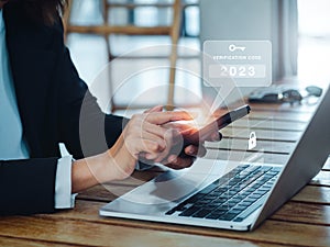 Two steps authentication 2FA concept. 2023, Verification code and key icon alert on smart phone while using computer.