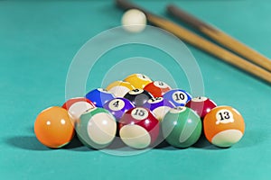 Two sticks with billiard balls