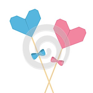 Two sticks with origami folded paper hearts and bows. Pink and blue pastel colors. Happy Valentines Day. Love greeting card templa