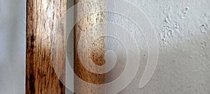 Two sticks and white wall