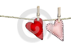 Two stitched hearts on a clothes line