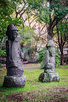 Two Stone idols (Dolharubang, the grandfather stones) in Jeju