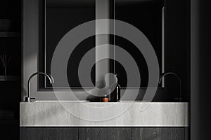 Two stone sinks in dark gray bathroom