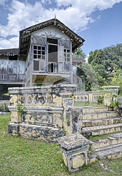 two-storey deserted malay structure cottage home.