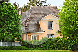 Two-storey house among the trees