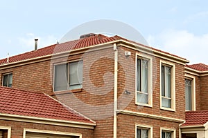 Two-Story Brick House Under Blue Spring Skies