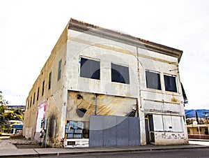 Two Story Commercial Building With Boarded Up Windows