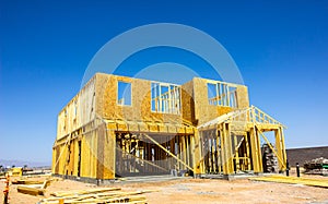 Two Story House In Framing Stage Of Construction