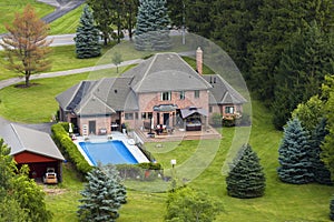 Two story private home in rural suburbs on Ontario lake shore outside of Rochester, New York. Upscale suburban house