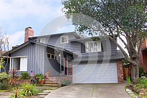 Two story ranch style house front of home