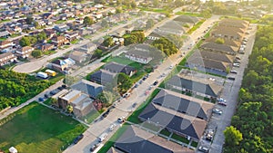 Two-story single-family home, townhouse, apartment complex with cul-de-sac and vacant land along Roger Drive in urban neighborhood