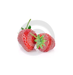 Two strawberries close up on white background