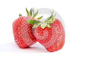 Two strawberries isolated on white background