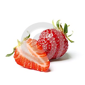 Two strawberries with strawberry leaf on white background