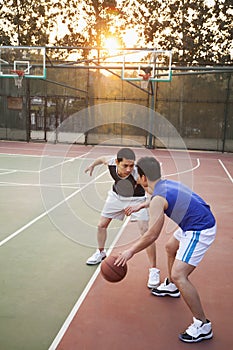 Two street basketball players on the basketball court