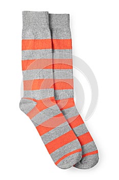 Two striped orange and gray socks isolated