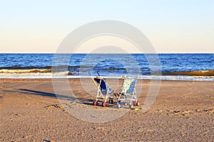 Two strollers on beach