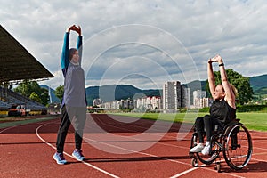 Two strong and inspiring women, one a Muslim wearing a burka and the other in a wheelchair stretching and preparing